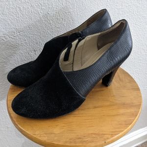 Black asymmetrical booties